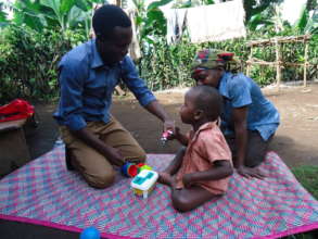 Physiotherapist David at home with Timothy