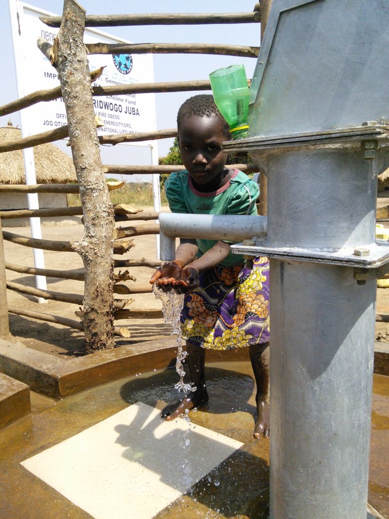 Collecting water for the first time in Aberidwogo
