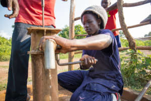 Broken water well being repaired.