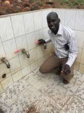 Pastor Christopher at the upgraded spring
