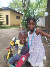 Nicholas sitting on a trike