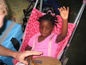 One of our children learning to play.