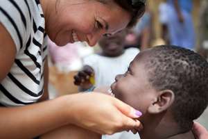 One of our staff, with one of our kids