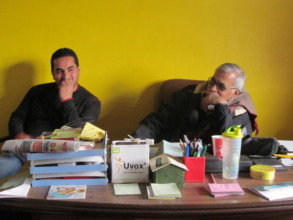 Rajiv Vora (right) explaining Gandhi