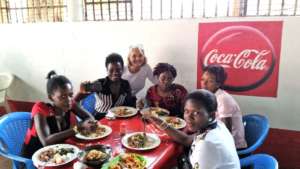 Stacy enjoys lunch with GWI's sponsored students