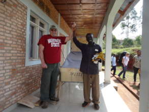 Volunteers celebrating the completion of the dryer