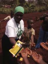 Ag consultant handing out seeds to youth
