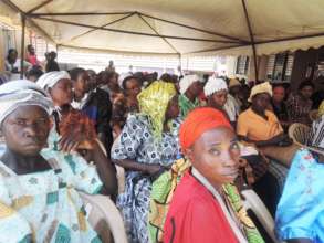 Clients wait for food packages on an AMS Food Day