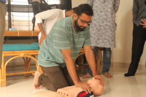 CriticaLink volunteer practicing child CPR