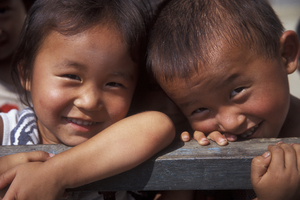 Two North Korean children smile for the camera