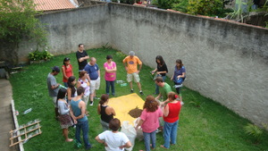 Preparing the soil to fill the containers.
