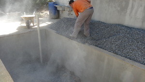 Filling evapotranspiration basin with fine grit