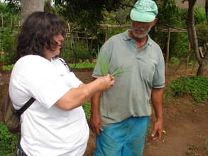 Denise, explaining some technique to the gardener.