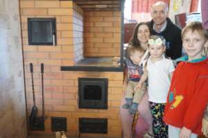 Vadim and Viktoria family with a new stove