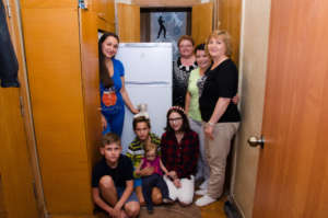 Presenting fridge to Roman and Olga large family