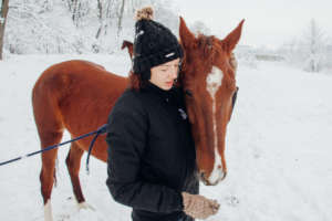 A caring touch is therapeutic for people & horses
