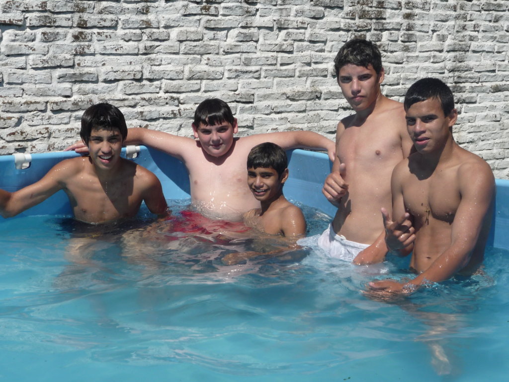 Youth enjoying the pool on a hot summer day.