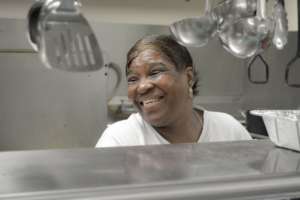 Deborah volunteers in the kitchen