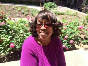Paula enjoys the sun in our community courtyard