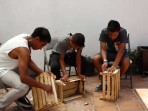 Skilled young men during a handcraft workshop