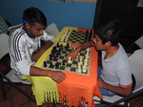 Strategic thinking: youths playing chess