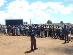 A FCI Staff addressing farmers during mobilization