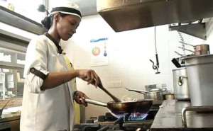 Lily cooking at Tres Restaurant