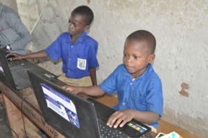 Joseph, primary four student learning how to type