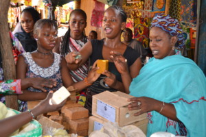 Program beneficiaries selling their soap at market
