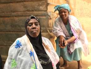 Aisha, left, makes soap at the Moussou cooperative