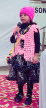 Tuba reciting a poem at launch event