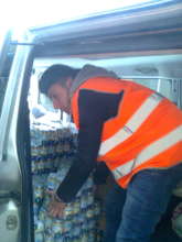 Volunteer helping with transfering of goods