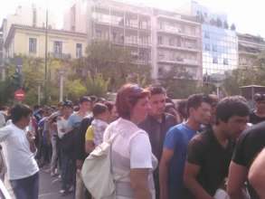 Refugees queuing for common meals