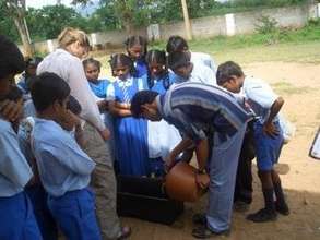 Students and teachers preping the container garden
