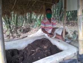 Nirapada with his vermi-composting bed
