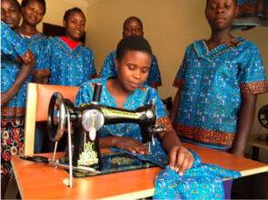A young woman working at a new sewing machine