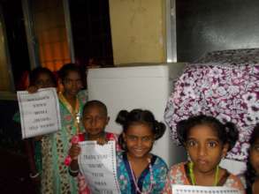 Children with the washing machine provided to home