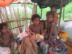 Children wait patiently while in camp