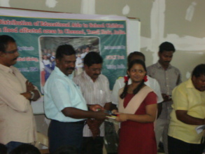 Thol. Thirumavalavan distributing edu aids to girl