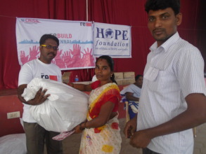Handing the relief kit to the Flood Victim