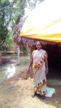 A tarpauline sheet covers flood affected house