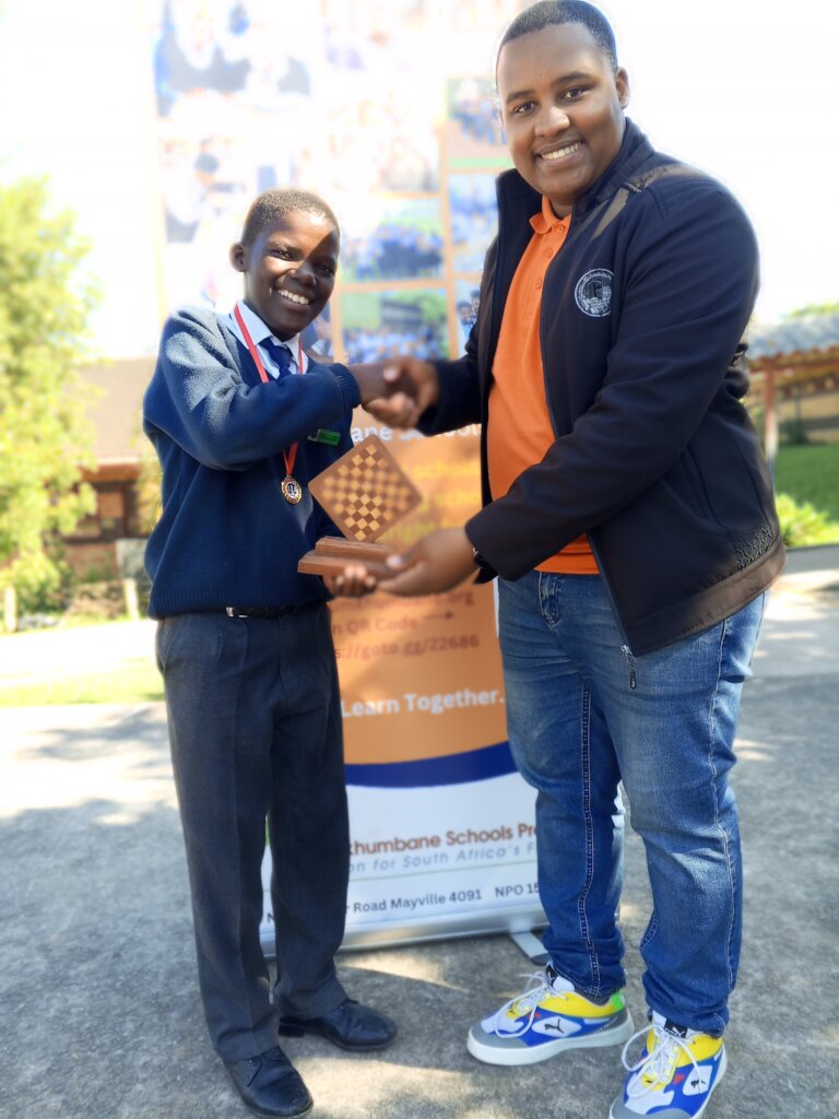 Joshua Tukushe Congratulates a Winning Player