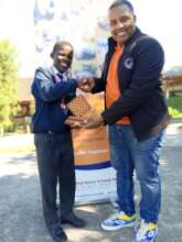 Joshua Tukushe Congratulates a Winning Player