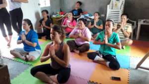 Yoga session with interns at the community hall