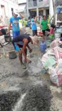 Everyone helps to build homes at the village