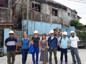 A Pay-what-you-can loan recipient with the team