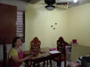 A homeowner in her newly-retrofitted dining room