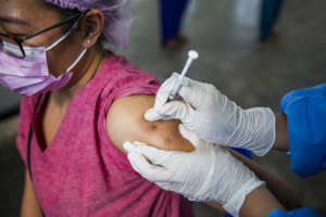 Health worker in Myanmar receives first dose