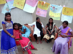 Girls with their drawings on floods