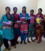 Poonguzhali in centre scored 1056/1200 in 12th Std